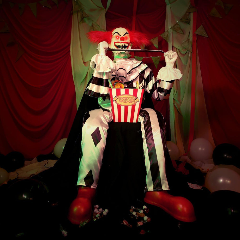 Haunted Hill Farm 4.1-Ft. Candy Clown Animatronic with Saw Halloween Decor