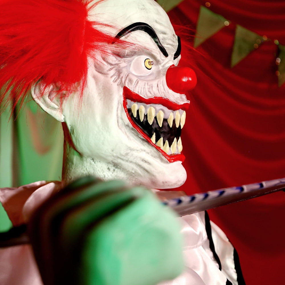 Haunted Hill Farm 4.1-Ft. Candy Clown Animatronic with Saw Halloween Decor