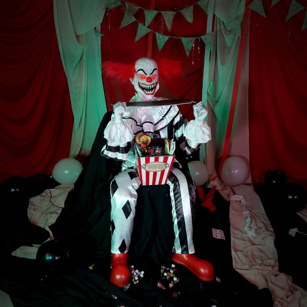 Haunted Hill Farm 4.1-Ft. Candy Clown Animatronic with Saw Halloween Decor