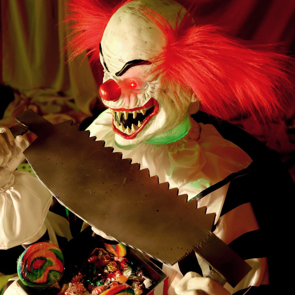 Haunted Hill Farm 4.1-Ft. Candy Clown Animatronic with Saw Halloween Decor